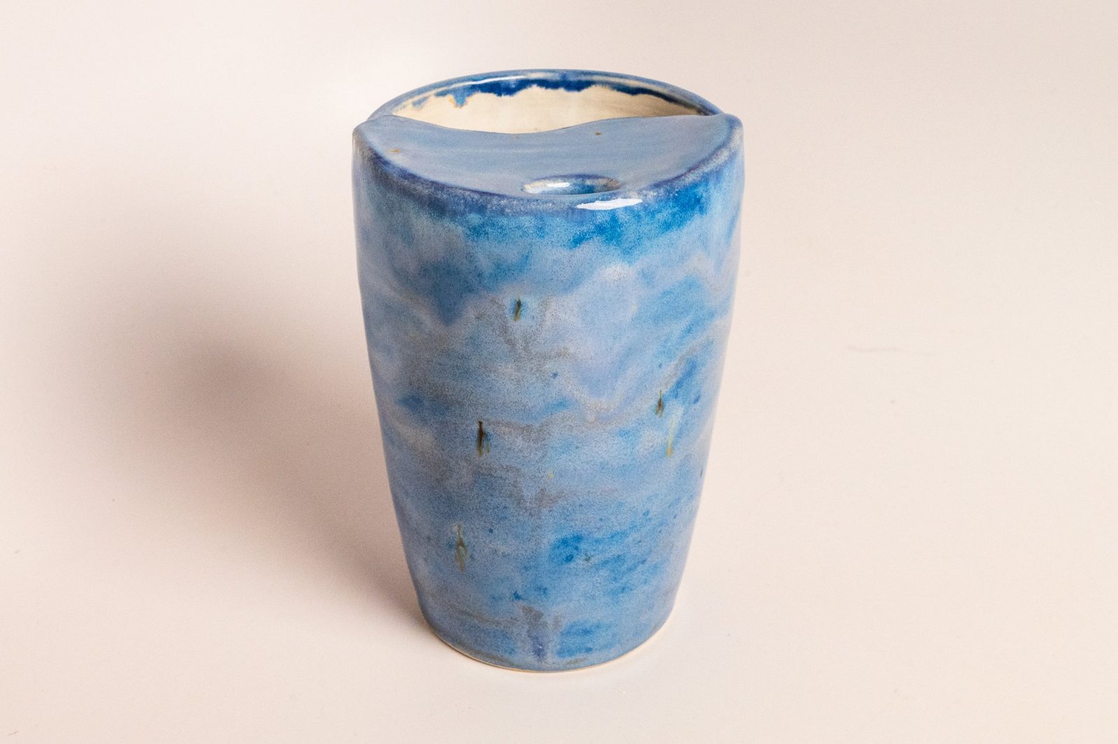 Travel mug in a mottled blue glaze